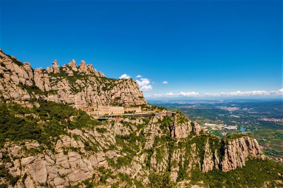 From Barcelona: Montserrat Monastery, Easy Hike, Cable Car - Taking the cable car above the monastery