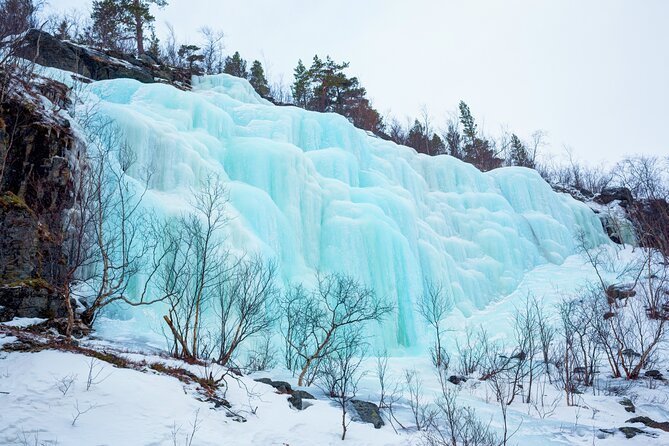 Hike to Frozen Waterfalls of Korouoma Including BBQ Lunch from Rovaniemi - Getting ready with thermal clothing