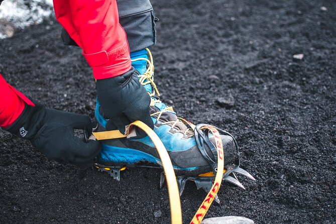 Private Guided Hike Experience on Sólheimajökull Glacier - Gearing up with crampons and safety equipment