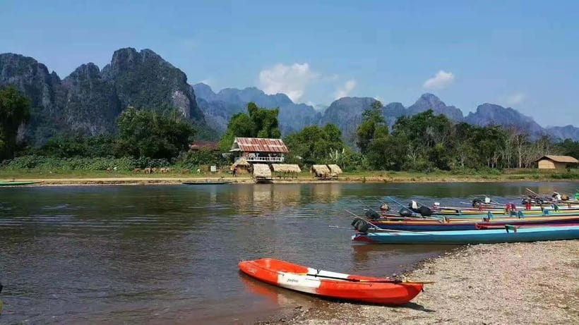 Vang Vieng: Day Tour with Kayaking, Ziplining, and Rafting - Ziplining over forest and river