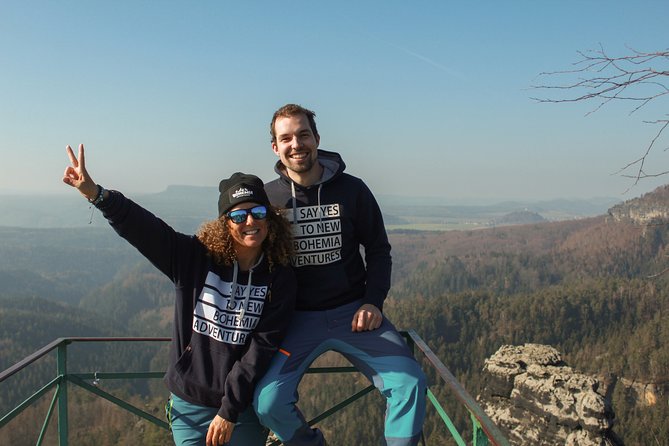 Winter Fairytale The BEST of Bohemian & Saxon Switzerland Hiking Tour - Winter clothing, walking, and border details